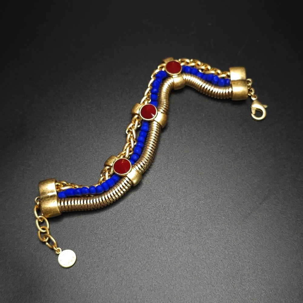 Vince Camuto gold tone triple strand chain bracelet.